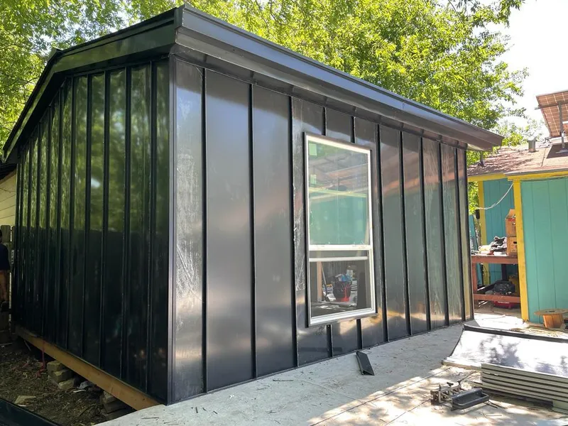 Black standing seam metal wall panels for Roof Inspection in Middlebury