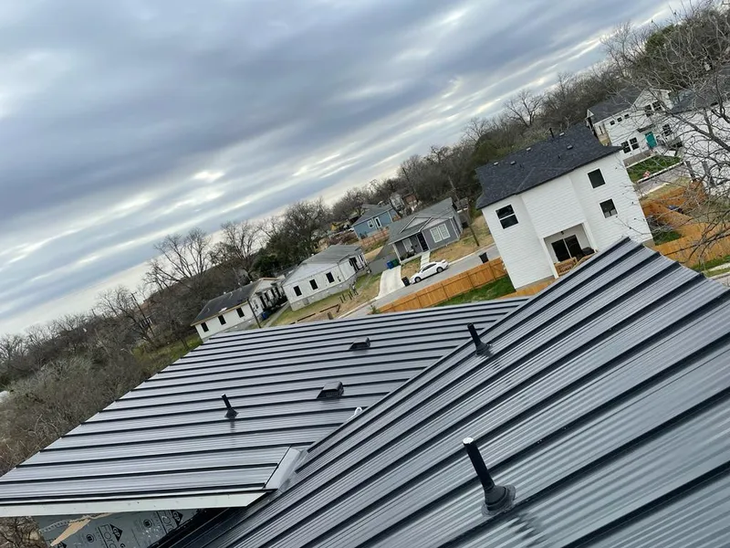 Standing seam metal roof panels with vents for Skylight Repair in Middlebury